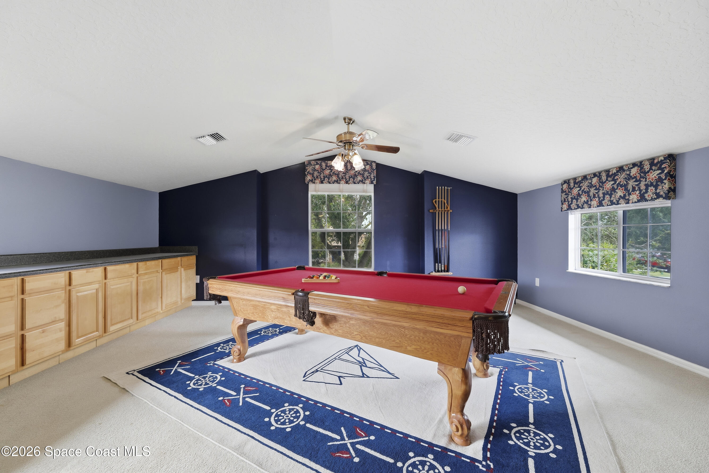 1643 Long Pine Road Melbourne, FL 32940 - Photo 44 of 63 a room with pool table and windows