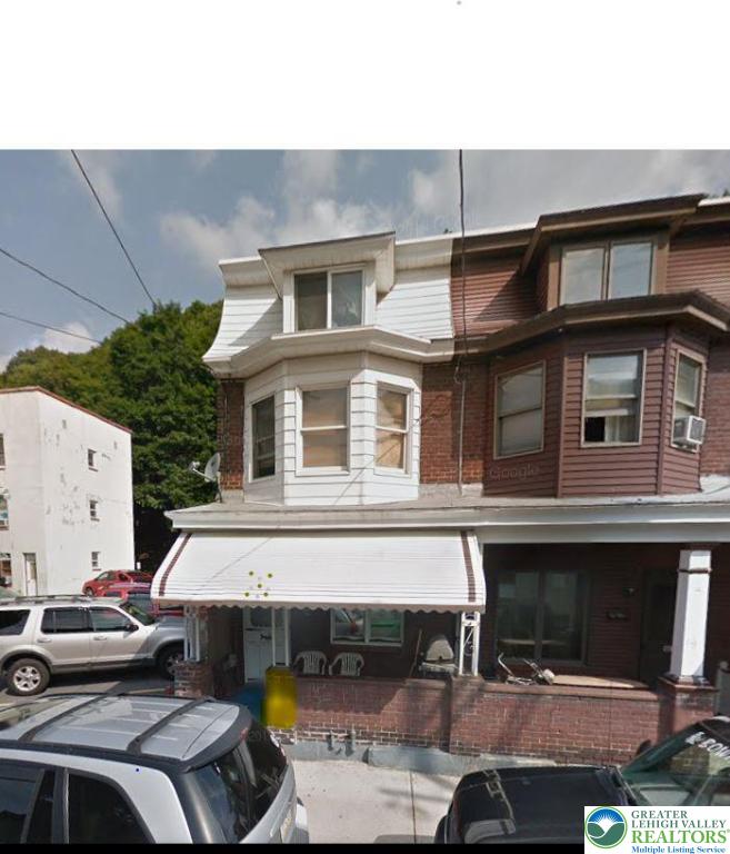 a front view of a house with parking