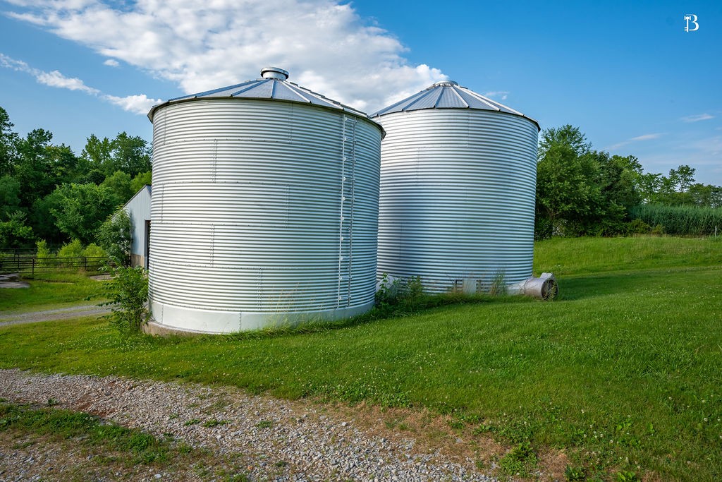 400 McIntosh Chapel Road Nortonville, KY 42442 - Photo 12 of 15 a front view of a house with a yard and garage
