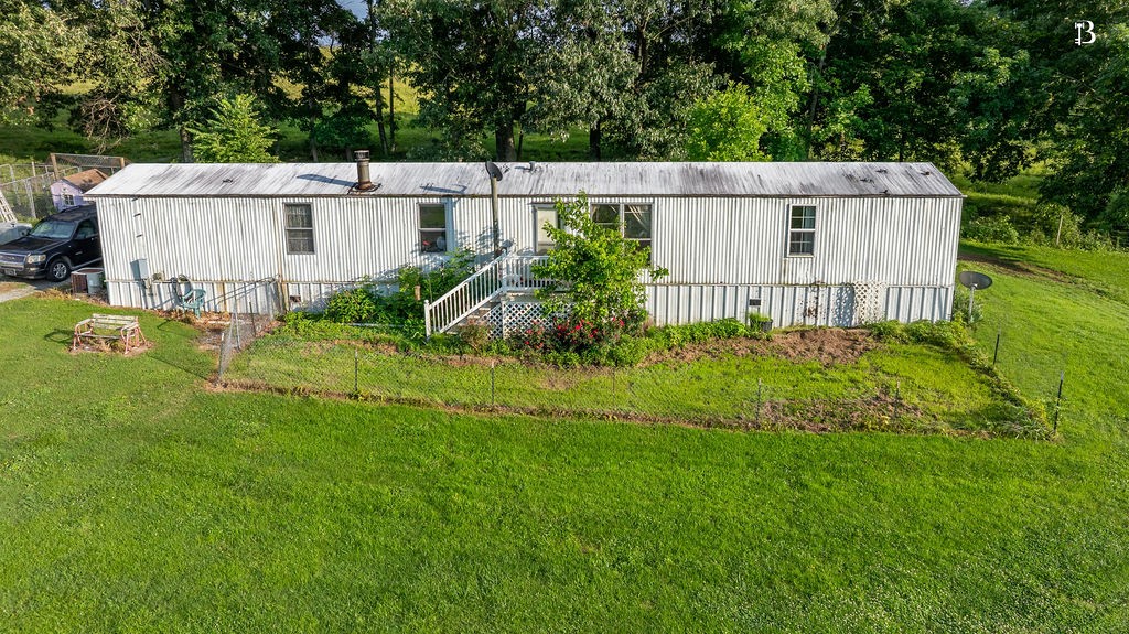 400 McIntosh Chapel Road Nortonville, KY 42442 - Photo 7 of 15 a view of a house with backyard and garden