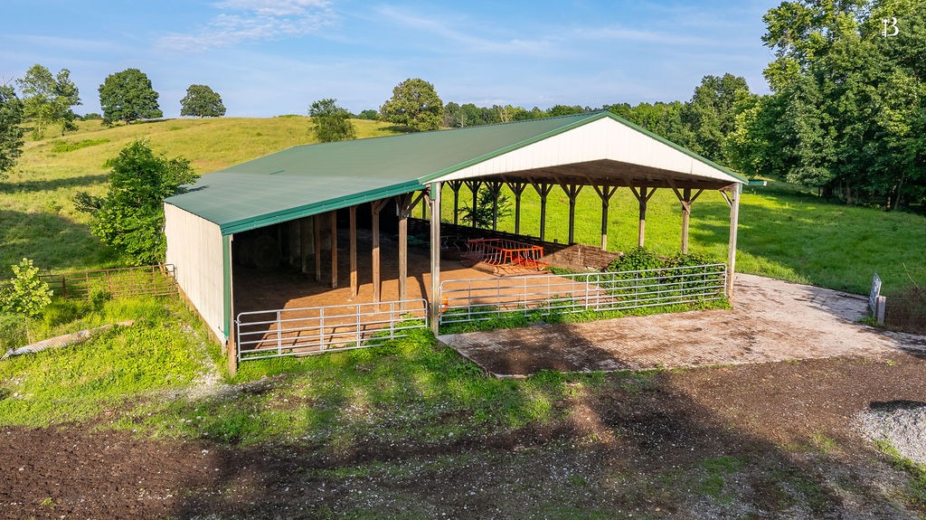 400 McIntosh Chapel Road Nortonville, KY 42442 - Photo 8 of 15 a view of a house with backyard and sitting area