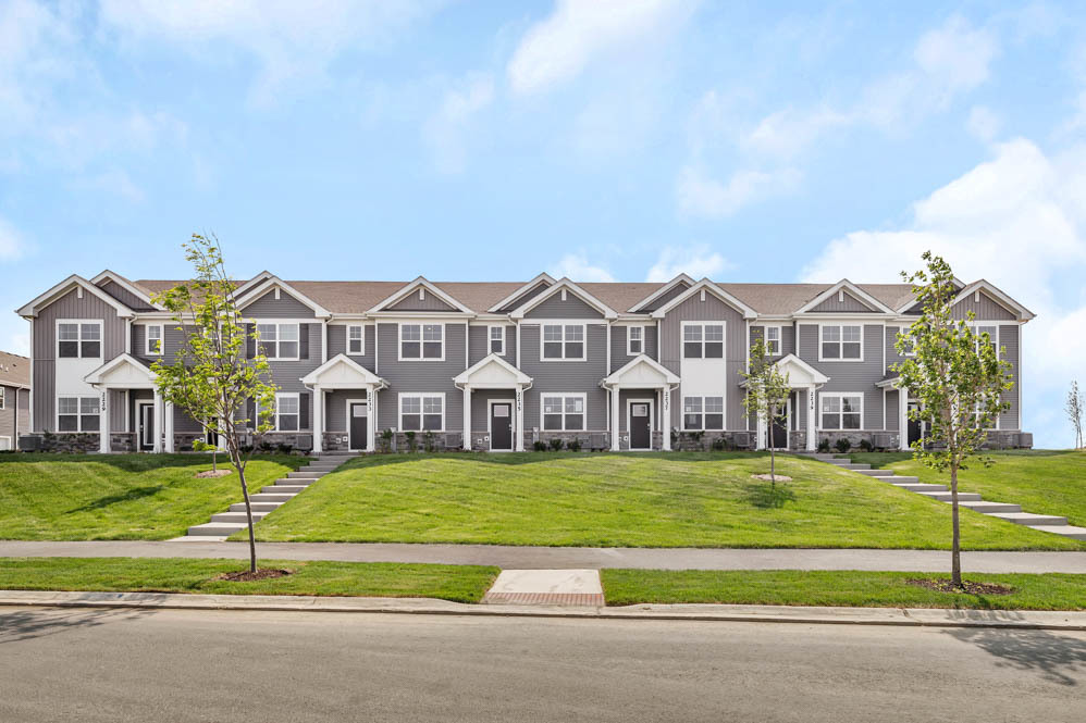 2253 Riesling Road Oswego, IL 60543 - Photo 1 of 27 a view of a big house with a big yard and large trees