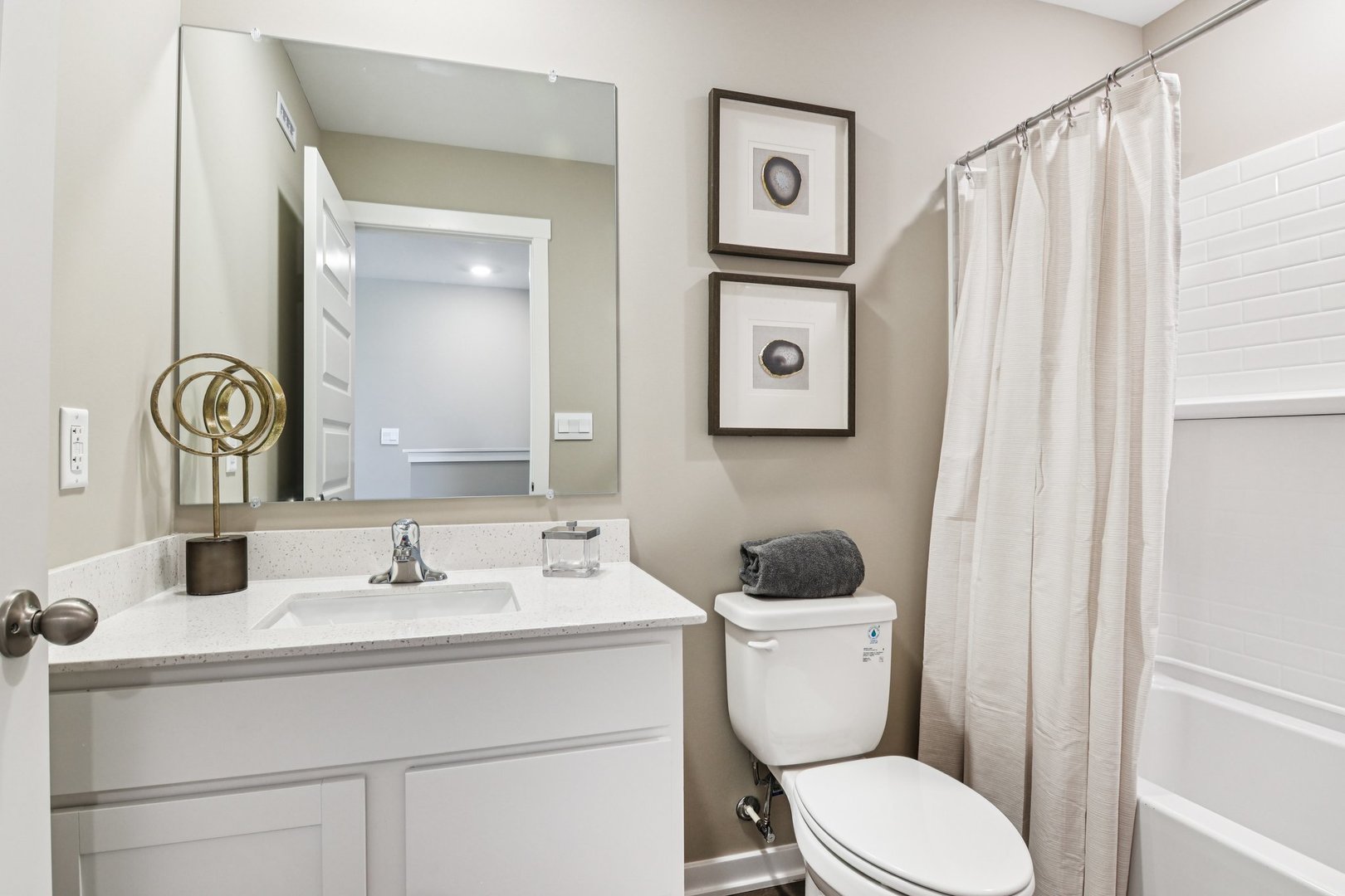 2253 Riesling Road Oswego, IL 60543 - Photo 23 of 27 a bathroom with a toilet sink and mirror