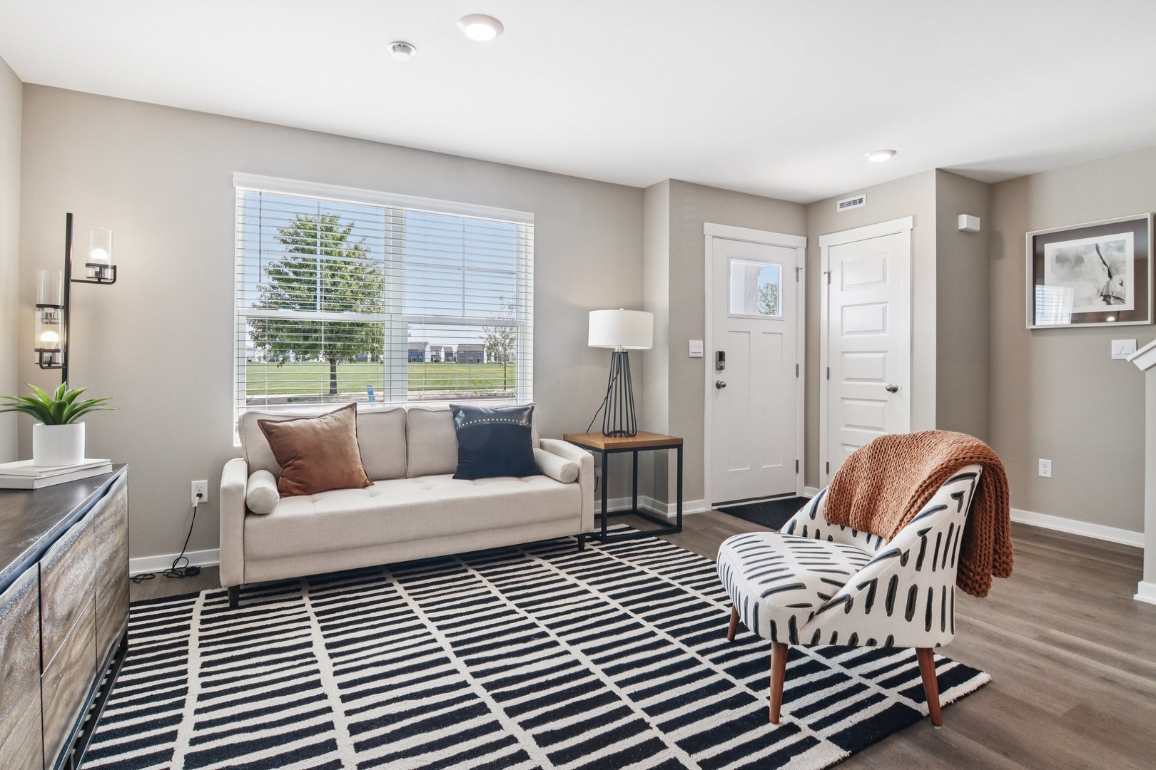 2253 Riesling Road Oswego, IL 60543 - Photo 5 of 27 a living room with furniture and wooden floor