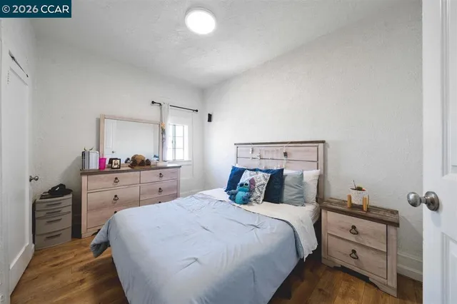 a bed room with a bed and a mirror