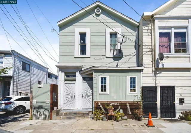 a front view of a house with parking