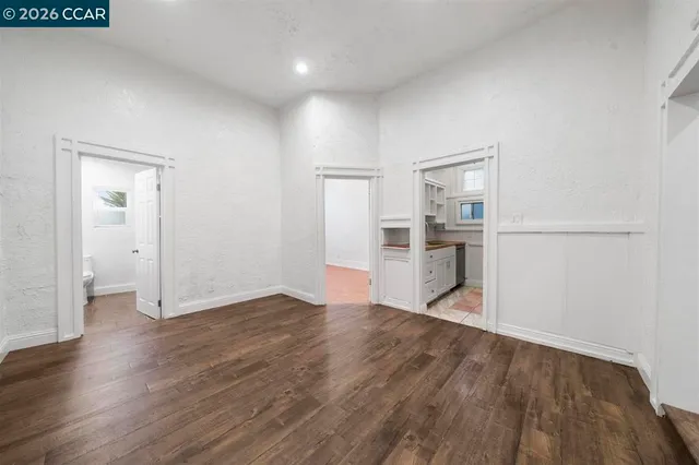 a kitchen with a sink cabinets and a window