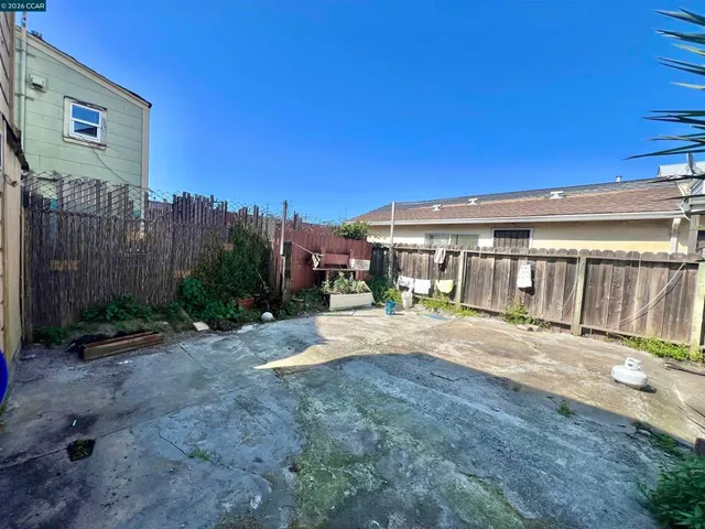 a view of house with outdoor space and sitting area