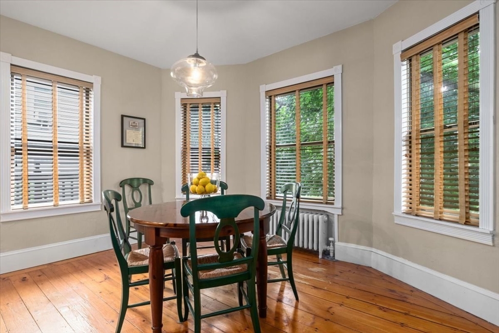 265 Sutton Street North Andover, MA 01845 - Photo 11 of 27 a dining room with furniture a chandelier and wooden floor
