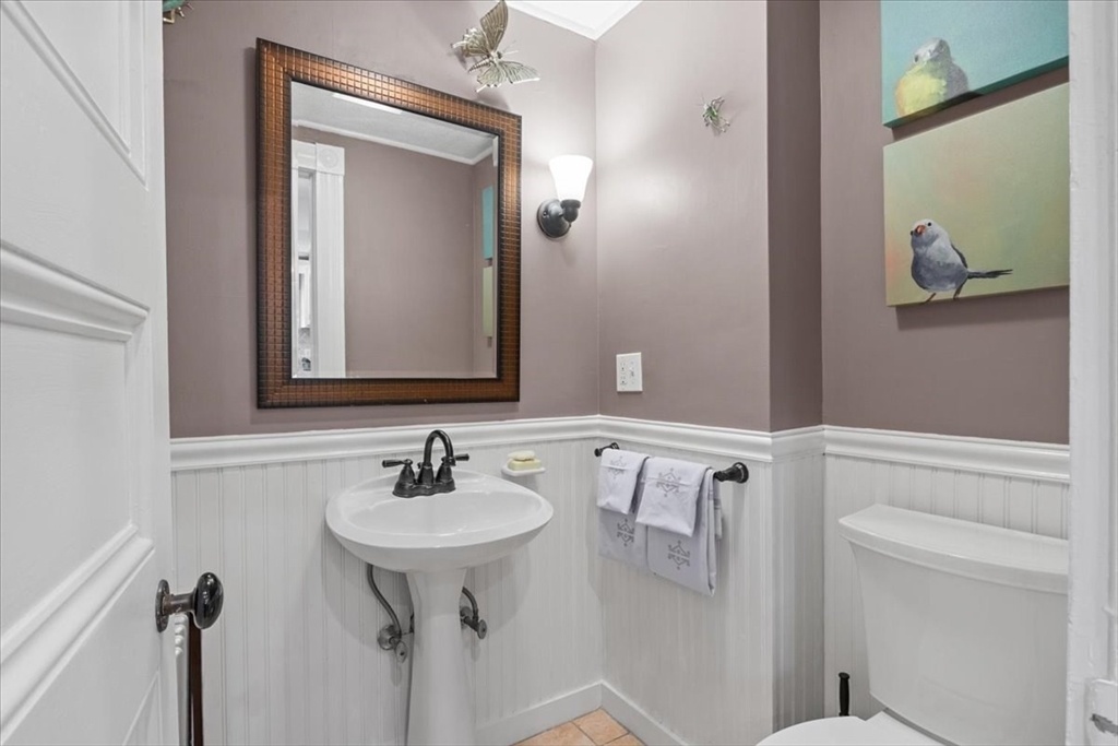 265 Sutton Street North Andover, MA 01845 - Photo 12 of 27 a bathroom with a sink and a mirror