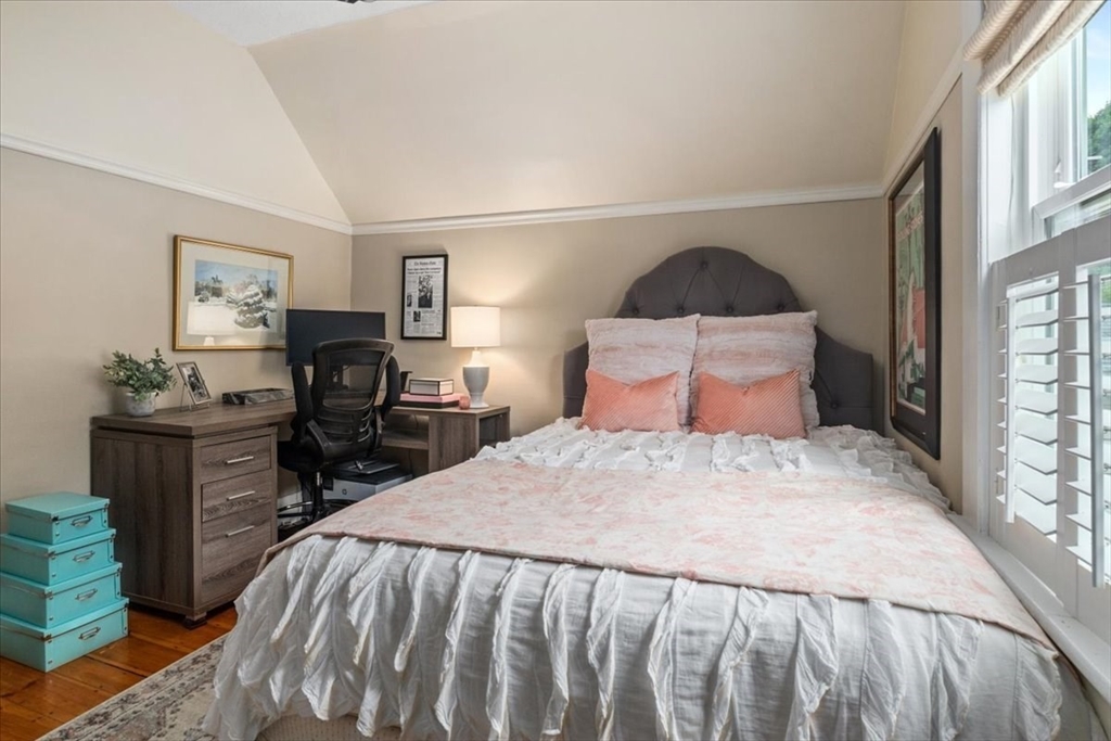 265 Sutton Street North Andover, MA 01845 - Photo 17 of 27 a bedroom with a bed and wooden floor