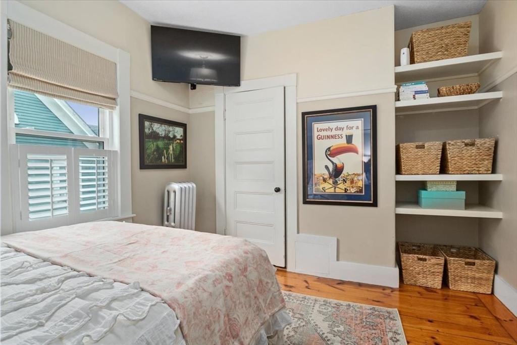 265 Sutton Street North Andover, MA 01845 - Photo 18 of 27 a bedroom with a bed and a flat screen tv