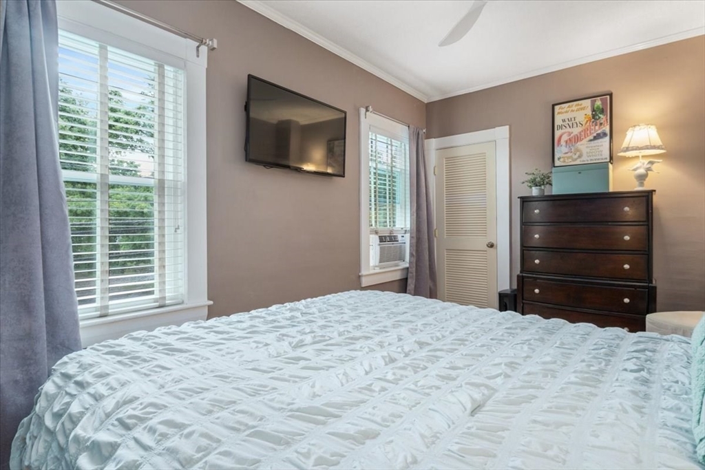 265 Sutton Street North Andover, MA 01845 - Photo 21 of 27 a bedroom with a bed and a television
