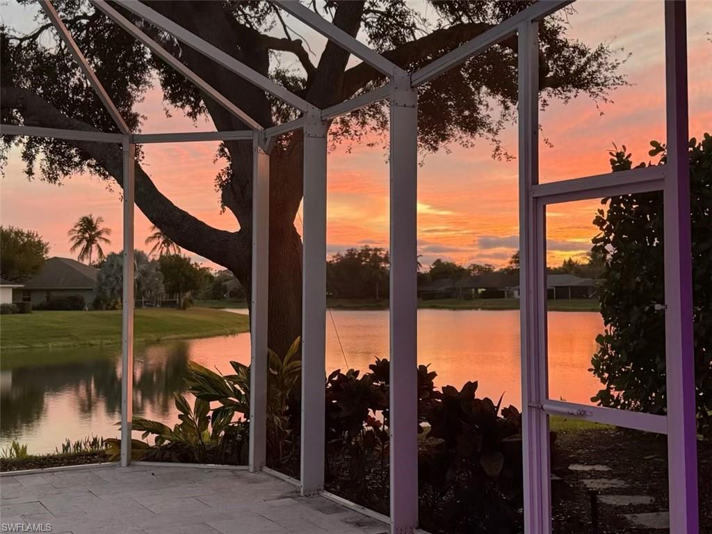 9974 Boca Avenue North Naples, FL 34109 - Photo 1 of 42 a view of a building from a tree