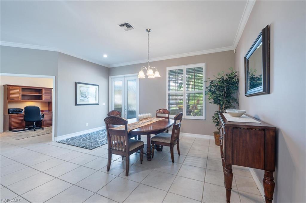 9974 Boca Avenue North Naples, FL 34109 - Photo 11 of 42 a view of a dining room with furniture window and outside view