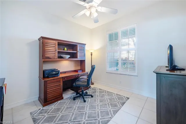a workspace with furniture and window