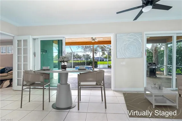 a dining room with furniture and a window