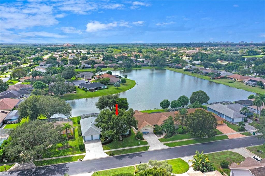 9974 Boca Avenue North Naples, FL 34109 - Photo 3 of 42 a view of a city and a lake view