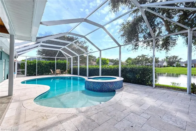 a view of a swimming pool with a patio
