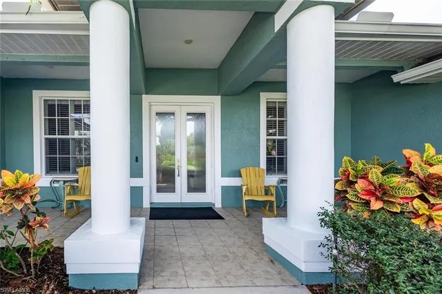 a front view of a house with outdoor seating