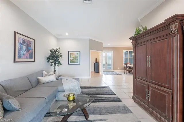a living room with furniture and a table