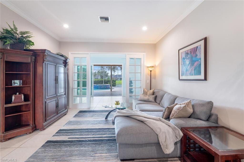 9974 Boca Avenue North Naples, FL 34109 - Photo 6 of 42 a living room with furniture and a potted plant