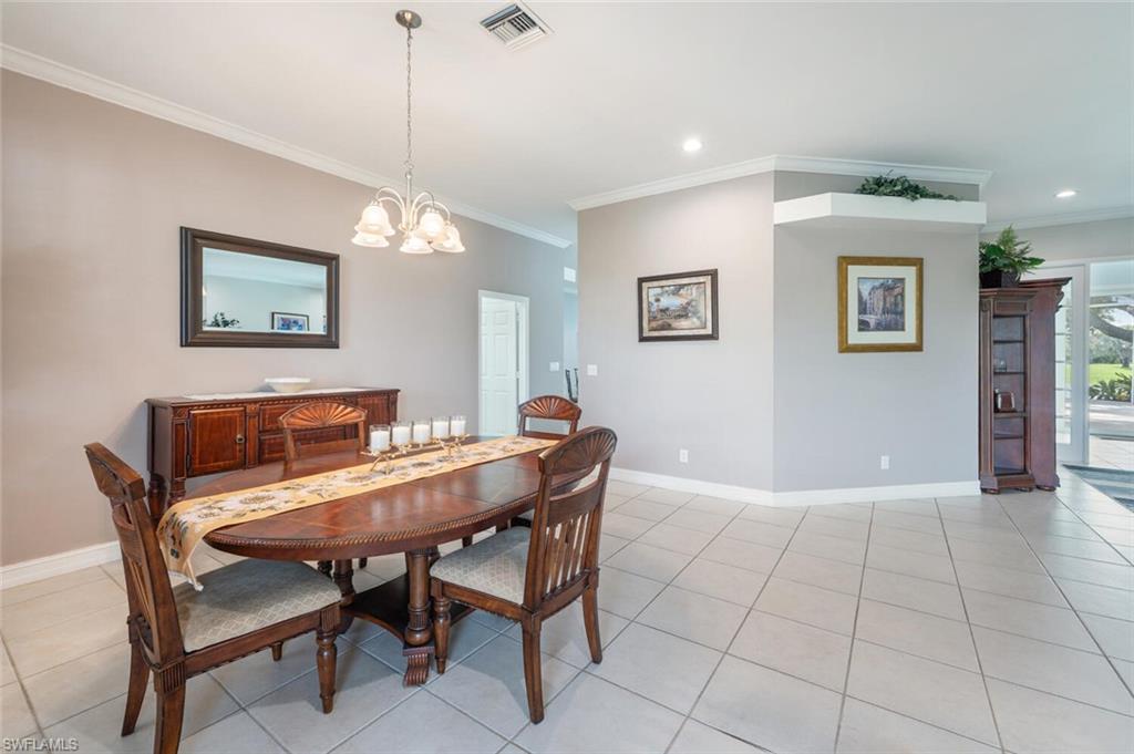 9974 Boca Avenue North Naples, FL 34109 - Photo 10 of 42 a dining room with furniture and window