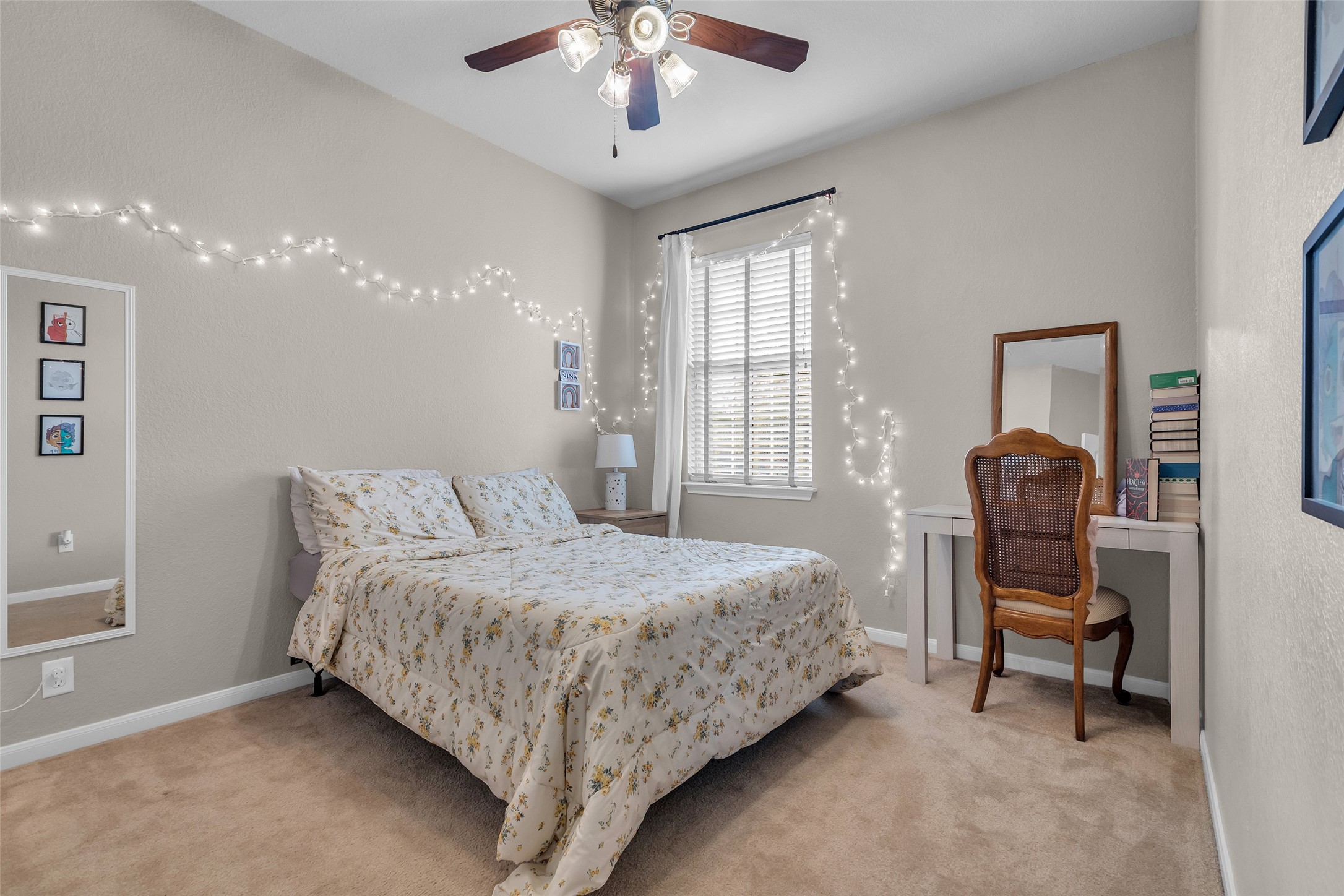 155 Magnolia Grove Lane Conroe, TX 77384 - Photo 19 of 25 3rd Bedroom with neutral walls and carpet, and a ceiling fan.