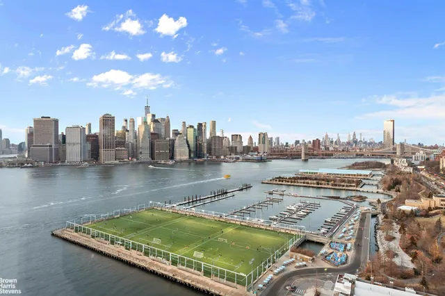 a view of a lake with a city