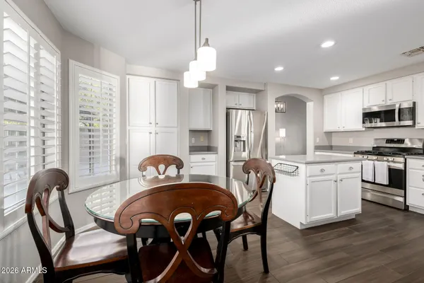 a view of a dining room with furniture and window