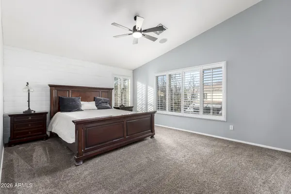 a bedroom with a bed and window