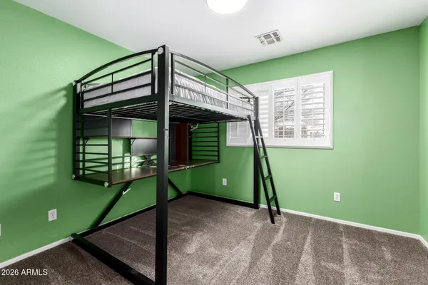 a view of a room with window and a ceiling fan