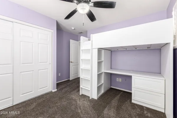 a en suite bathroom with a double vanity sink and a mirror