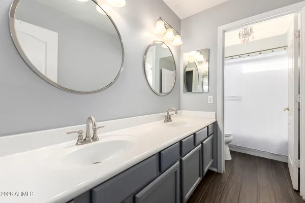 a bathroom with a sink toilet tub and shower