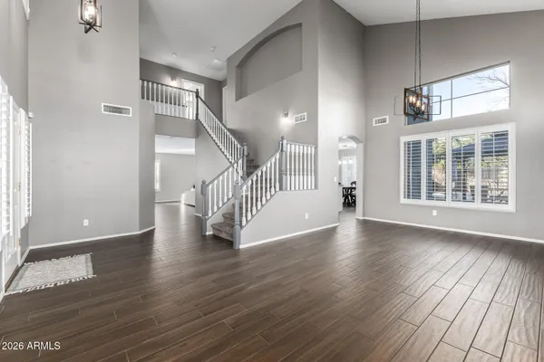 a view of an entryway with wooden floor