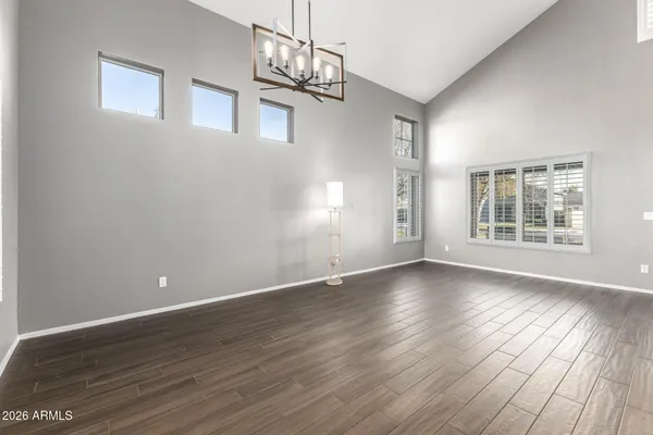 a view of wooden floor and windows in an empty room