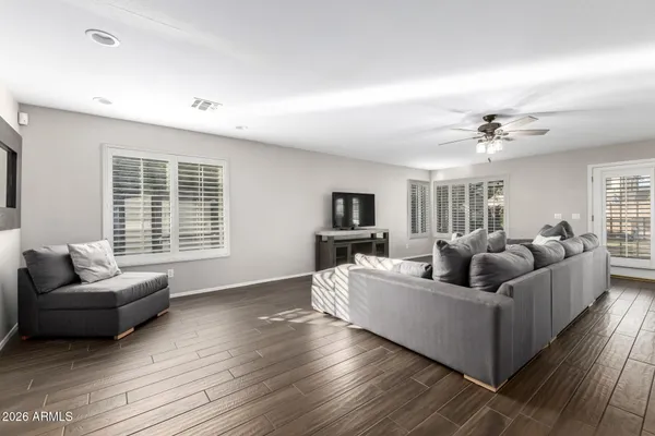 a living room with furniture and a large window