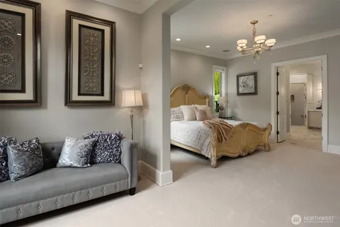 a living room with furniture and a chandelier