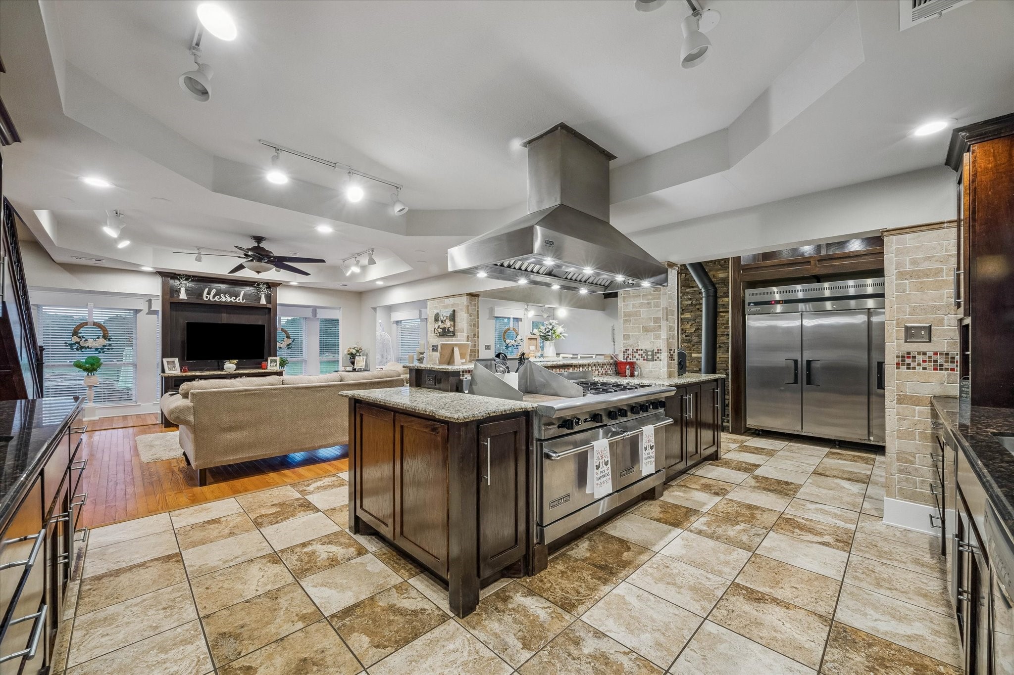 3515 County Road 36 Angleton, TX 77515 - Photo 12 of 50 a large kitchen with stainless steel appliances and a large window