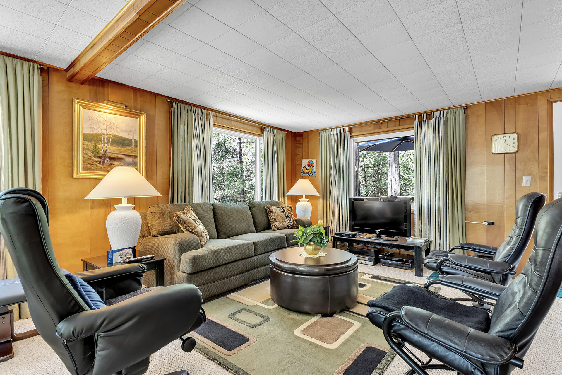 26975 Idyllwild Road Idyllwild, CA 92549 - Photo 24 of 65 a living room with furniture a flat screen tv and a large window