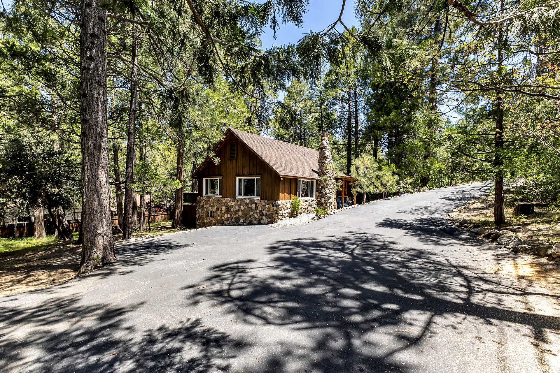26975 Idyllwild Road Idyllwild, CA 92549 - Photo 4 of 65 a front view of a house with a yard covered in snow