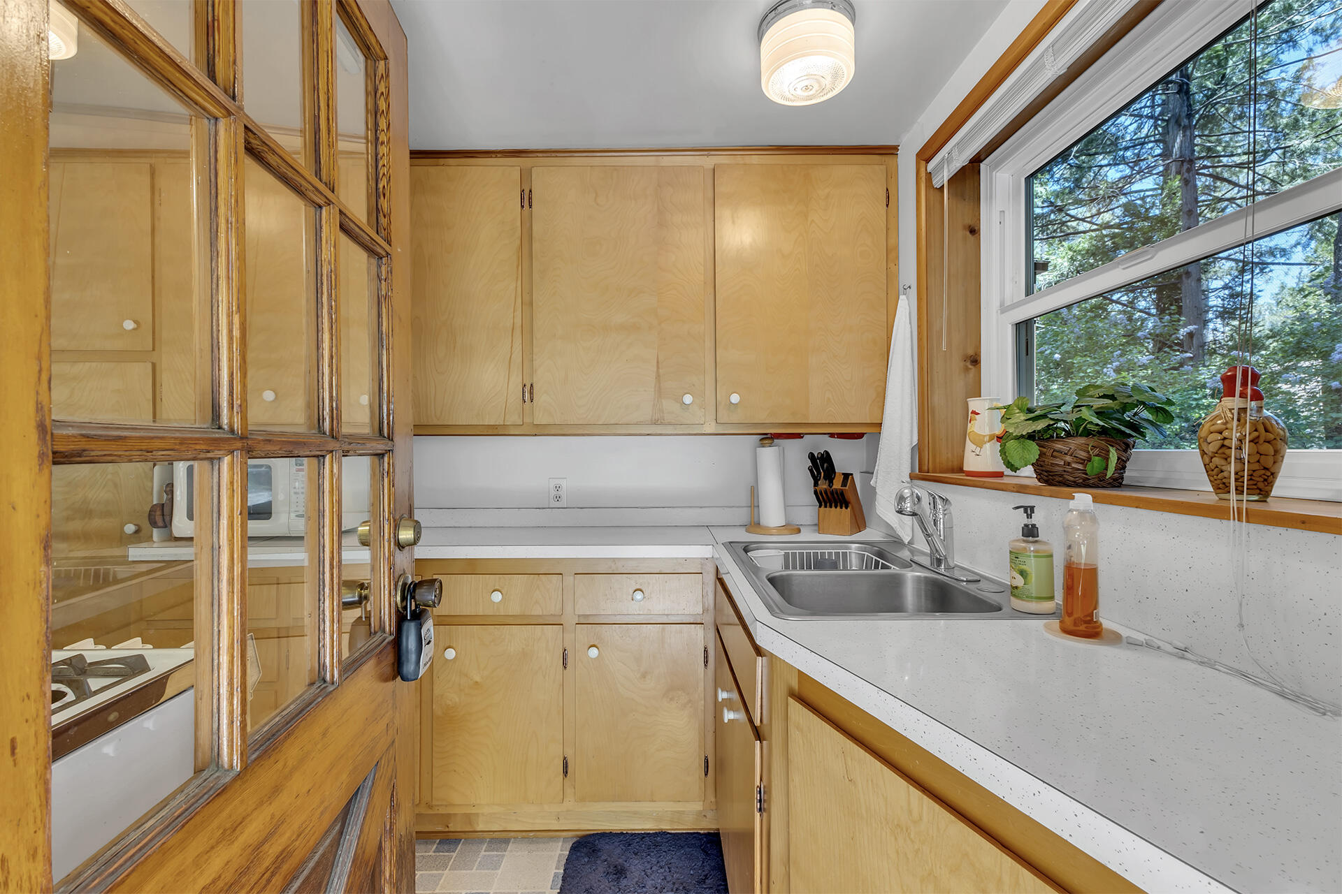 26975 Idyllwild Road Idyllwild, CA 92549 - Photo 10 of 65 a kitchen with a sink a counter top space and stainless steel appliances