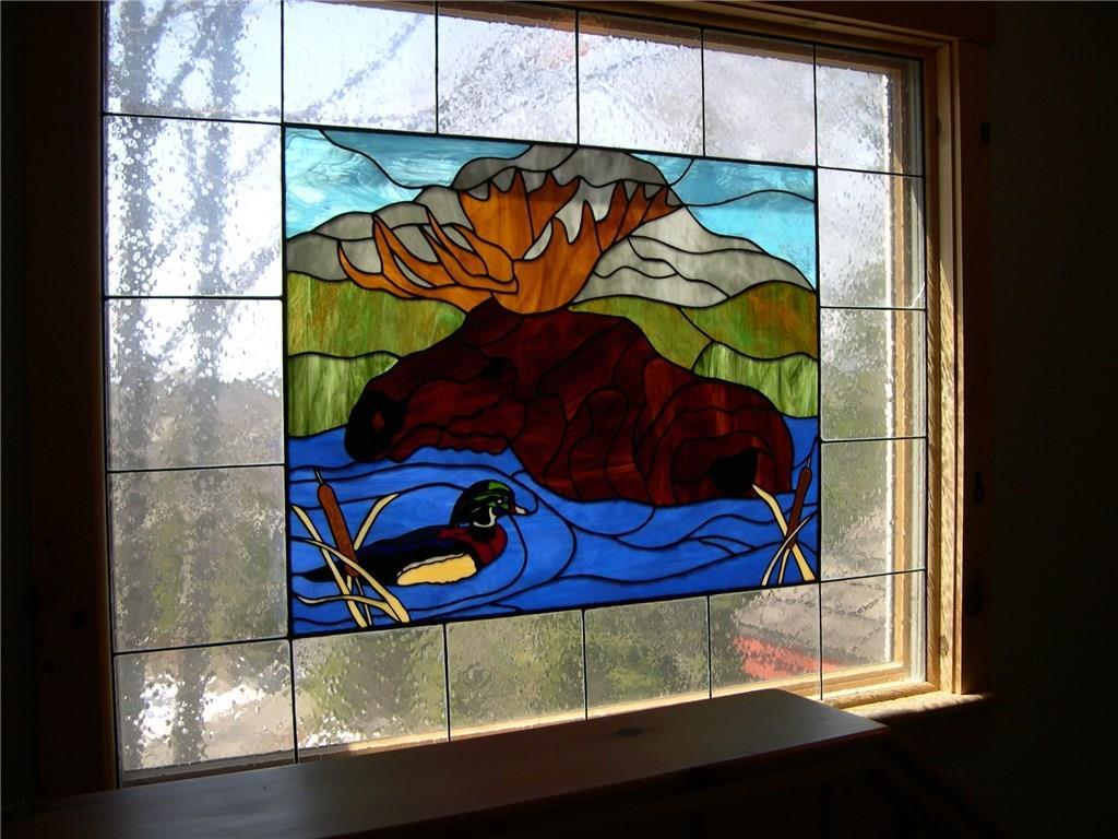 68 Harold Ross Road Dallas Plt, ME 04970 - Photo 15 of 37 stained glass window on 2nd floor