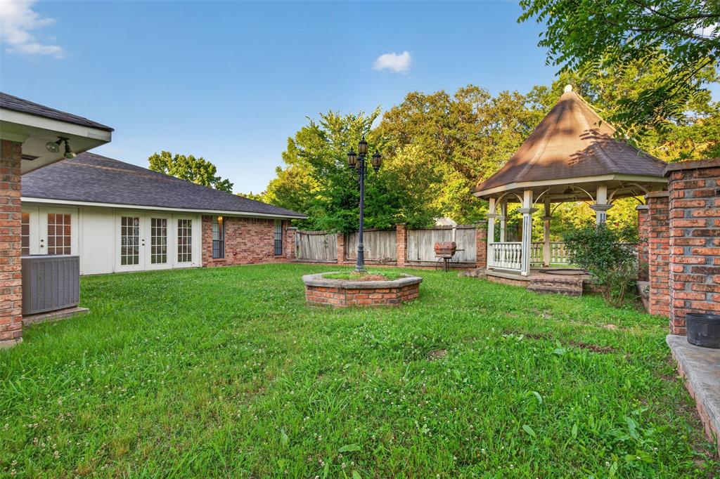 401 Cane Bend Drive Haughton, LA 71037 - Photo 19 of 27 a view of a house with a yard and sitting area