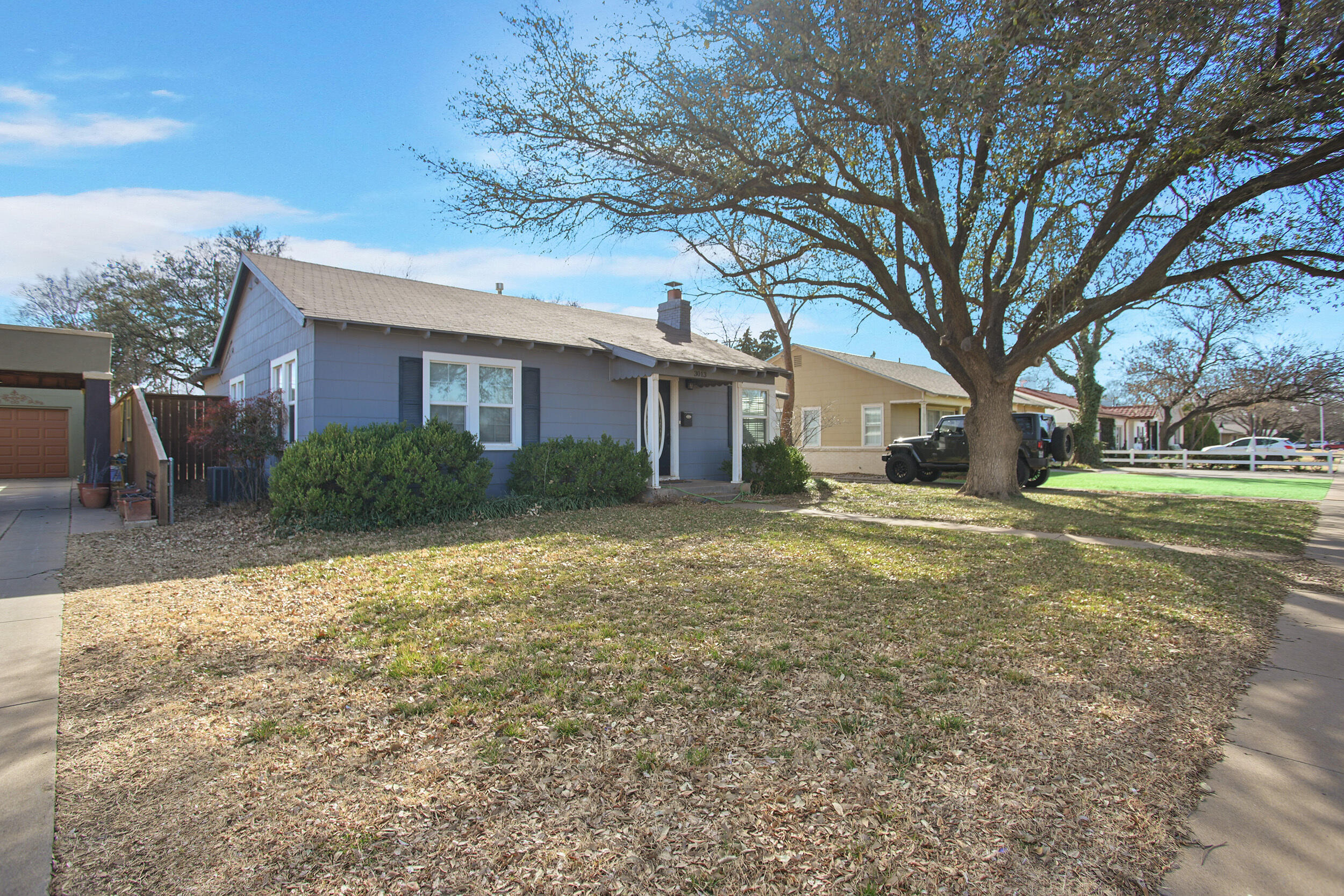 3013 28th Street Lubbock, TX 79410 - Photo 2 of 38 a view of a house with a yard