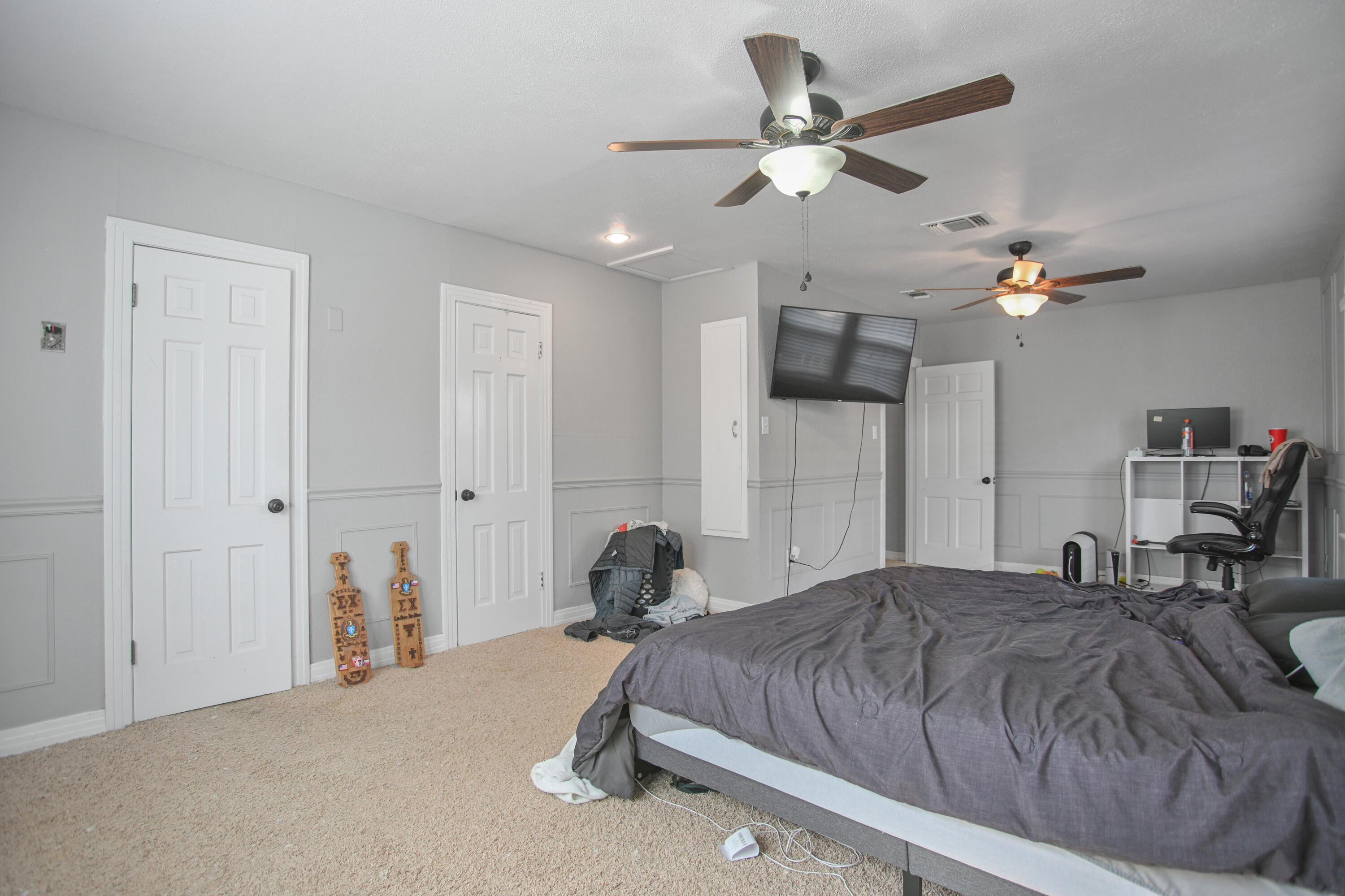 3013 28th Street Lubbock, TX 79410 - Photo 23 of 38 a bedroom with a bed and a ceiling fan