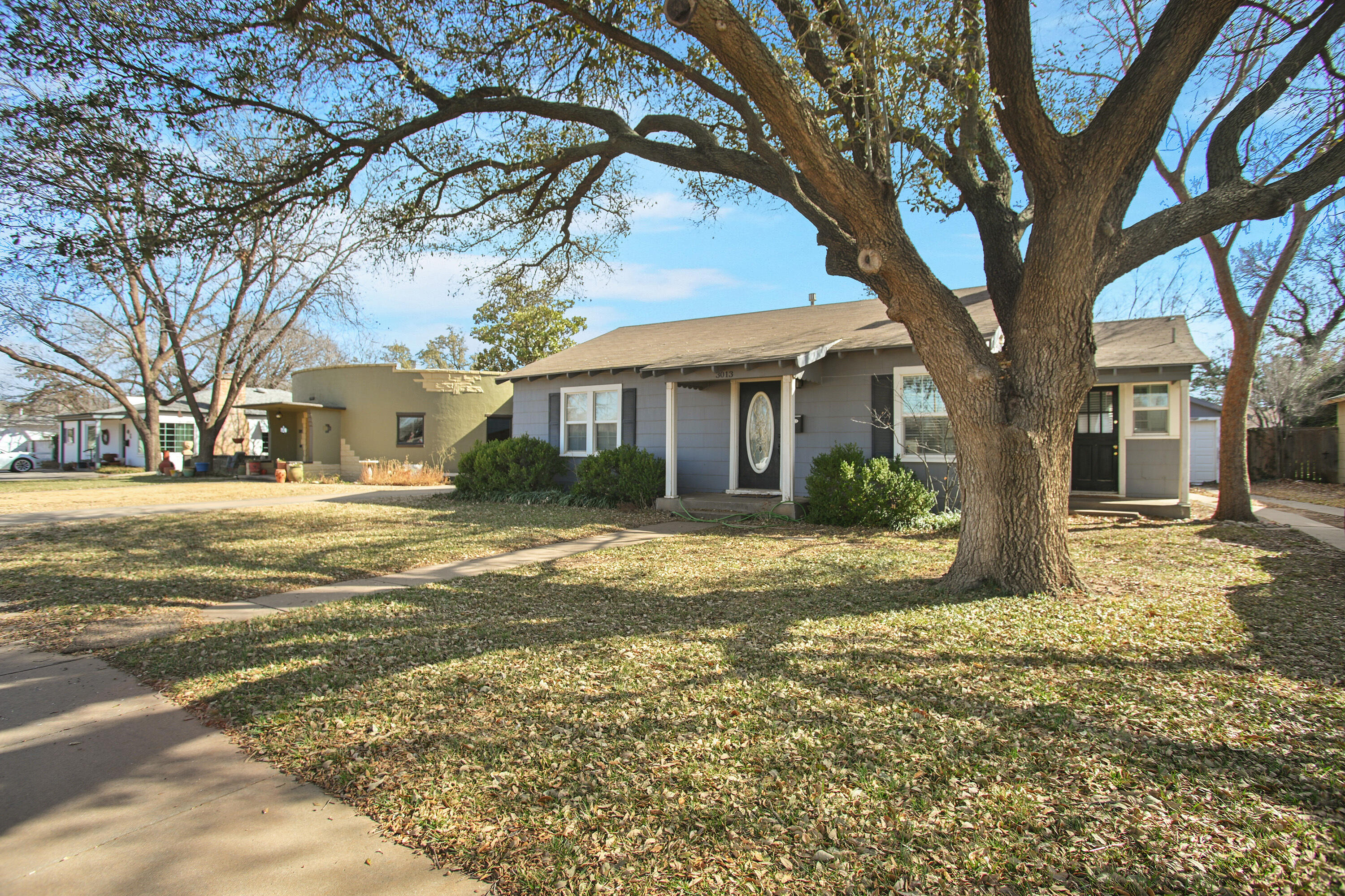3013 28th Street Lubbock, TX 79410 - Photo 3 of 38 a view of a trees in front of a house