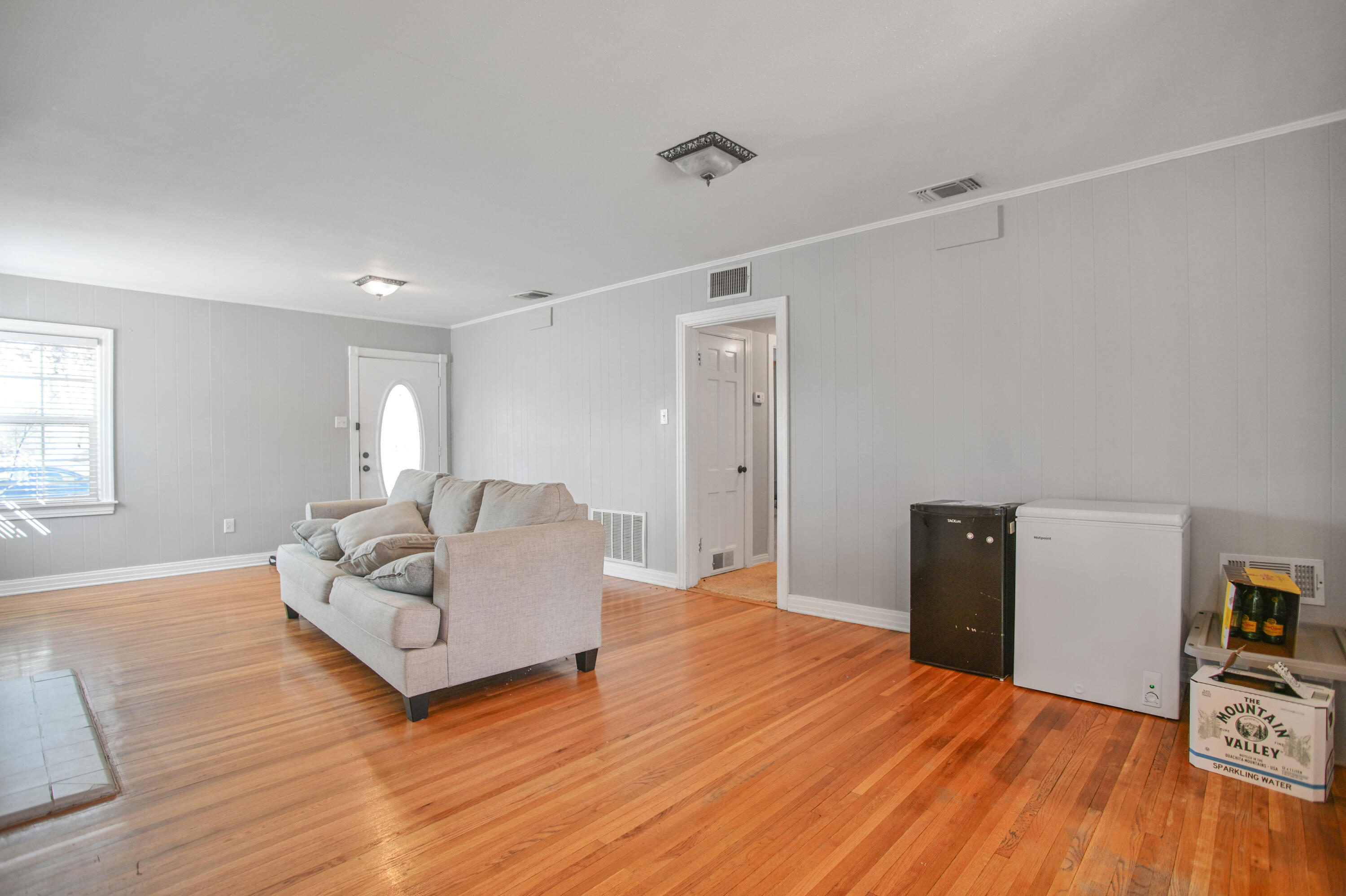 3013 28th Street Lubbock, TX 79410 - Photo 8 of 38 a living room with furniture and a wooden floor