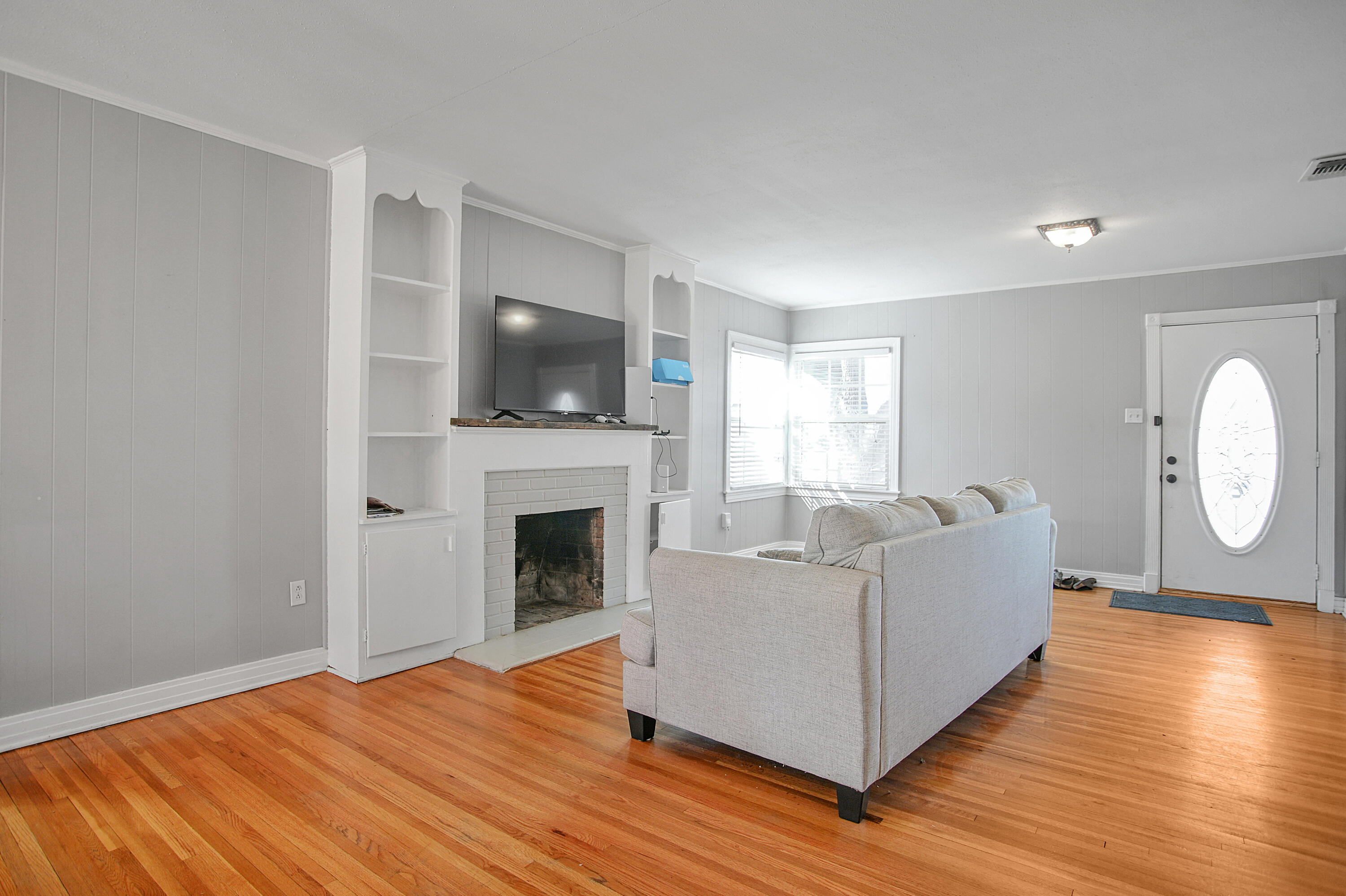 3013 28th Street Lubbock, TX 79410 - Photo 9 of 38 a living room with furniture and a fireplace
