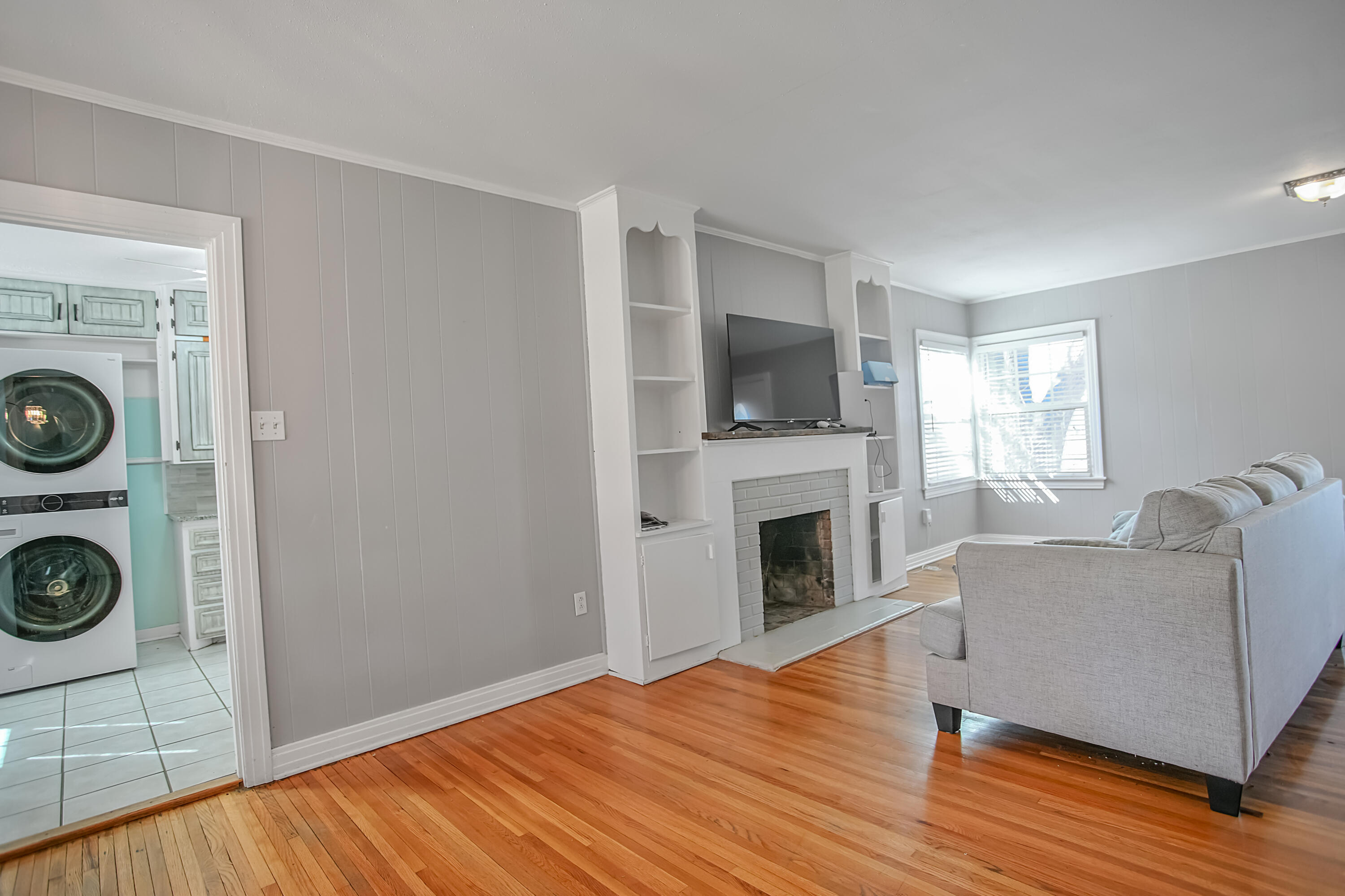 3013 28th Street Lubbock, TX 79410 - Photo 10 of 38 a living room with furniture and a fireplace